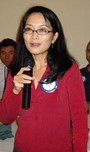 Amy Tran, coordinator, congratulates the club on a very successful 'Giving Tree' effort for needy families in Woodland.